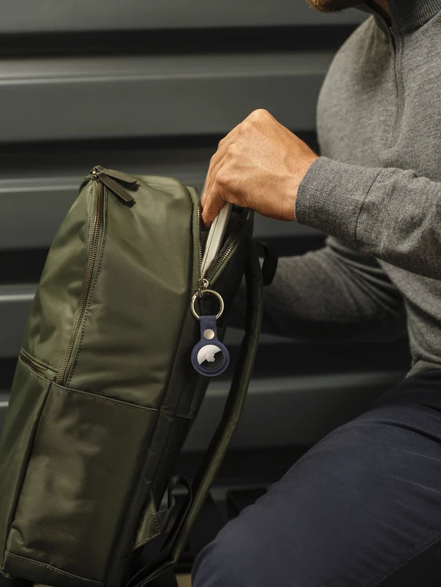 AirTag attached to a green backpack