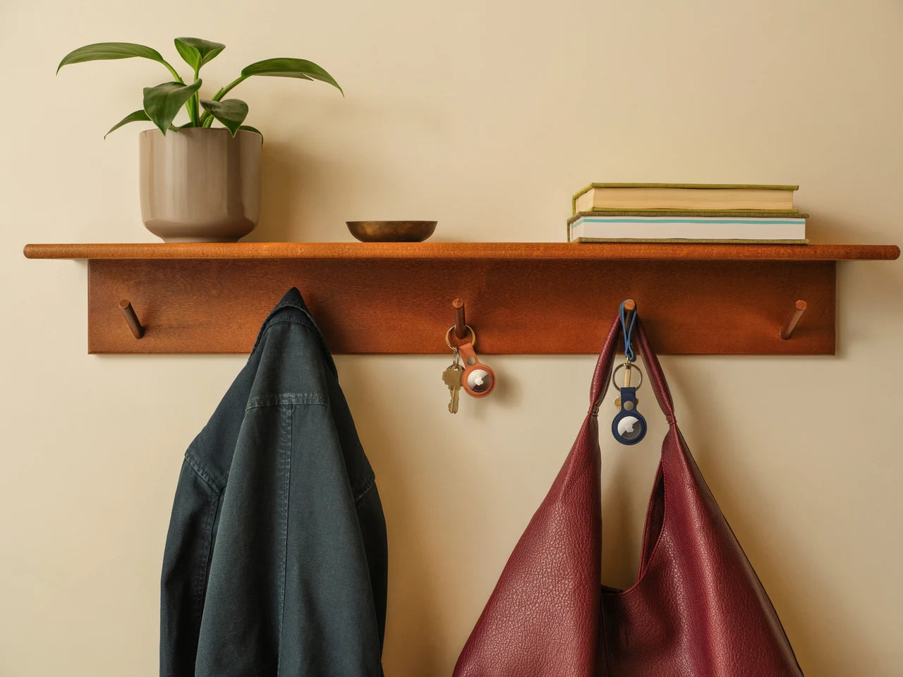 Keys and bags with AirTag by the door